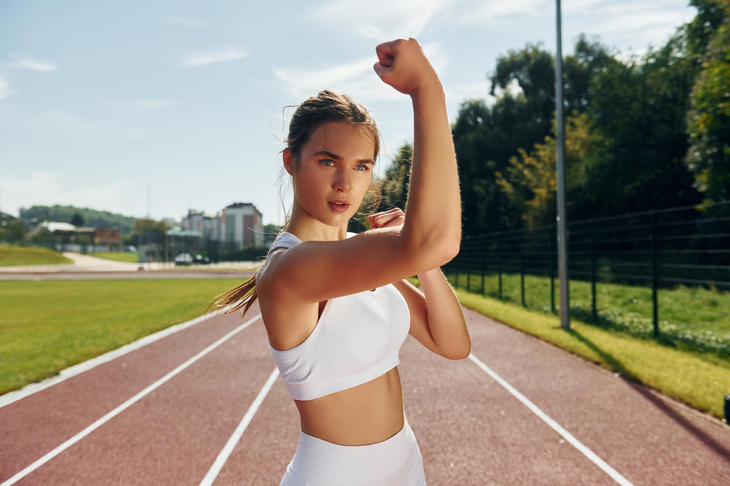 Self defence conception. Young woman in sportive clothes is exercising outdoors